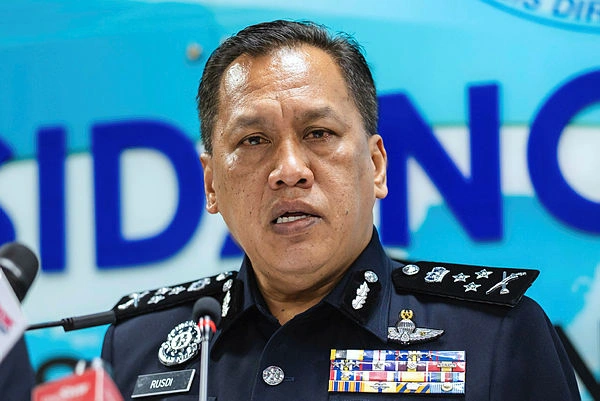 Malaysian man freed in Pakistan scam raid returns home
