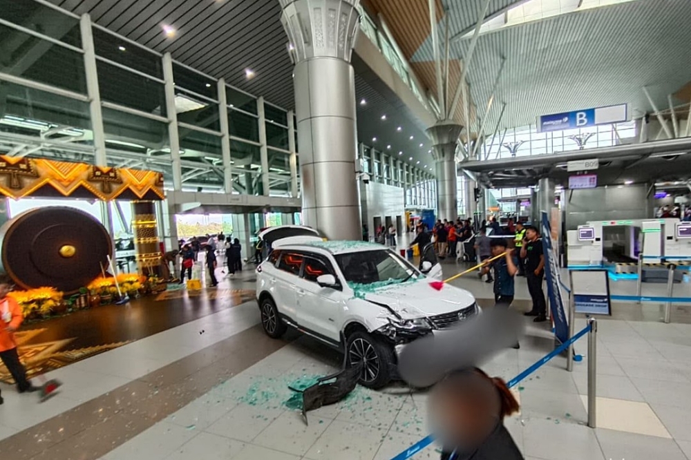 Woman hurt after SUV crashes into KKIA departure hall