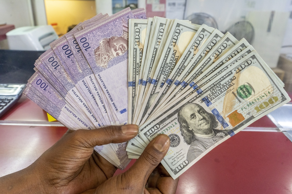 Ringgit slips against US dollar ahead of key US inflation data, ends mostly higher